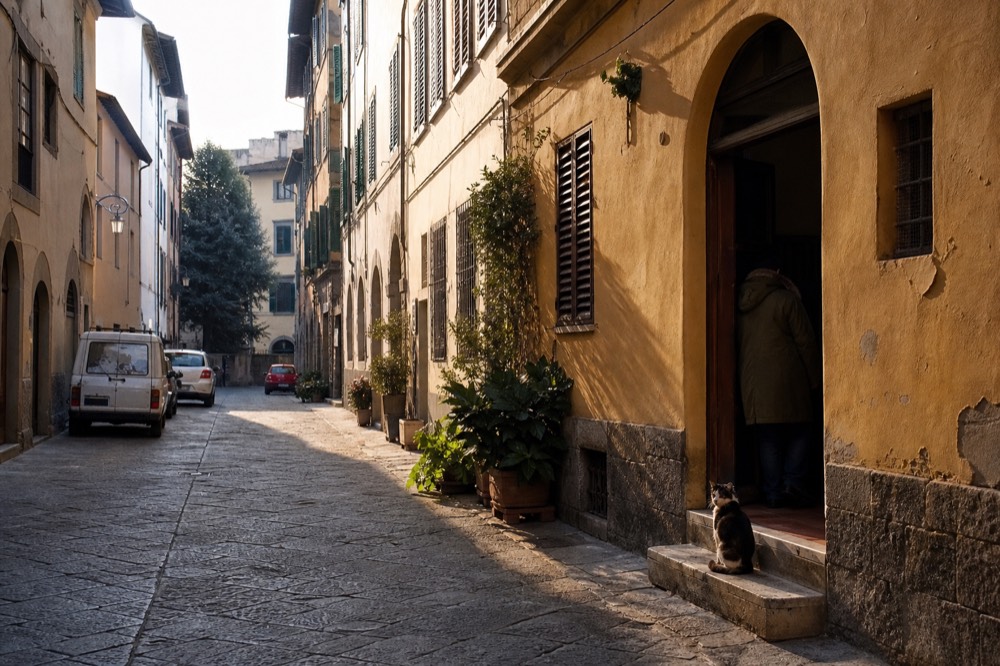 Quiet side street in central Florence with stone palazzi and a bicycle leaning against a wall
