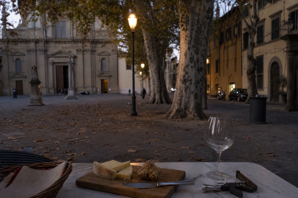 Autumn table with white truffle, cheese wedges and a corkscrew