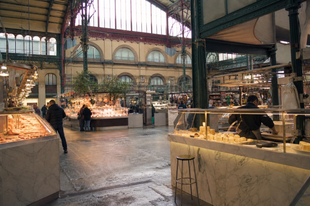 Inside Mercato Centrale ground floor with meat and cheese counters