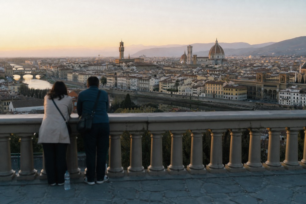 A view of the Duomo from a Florence rooftop terrace at sunset